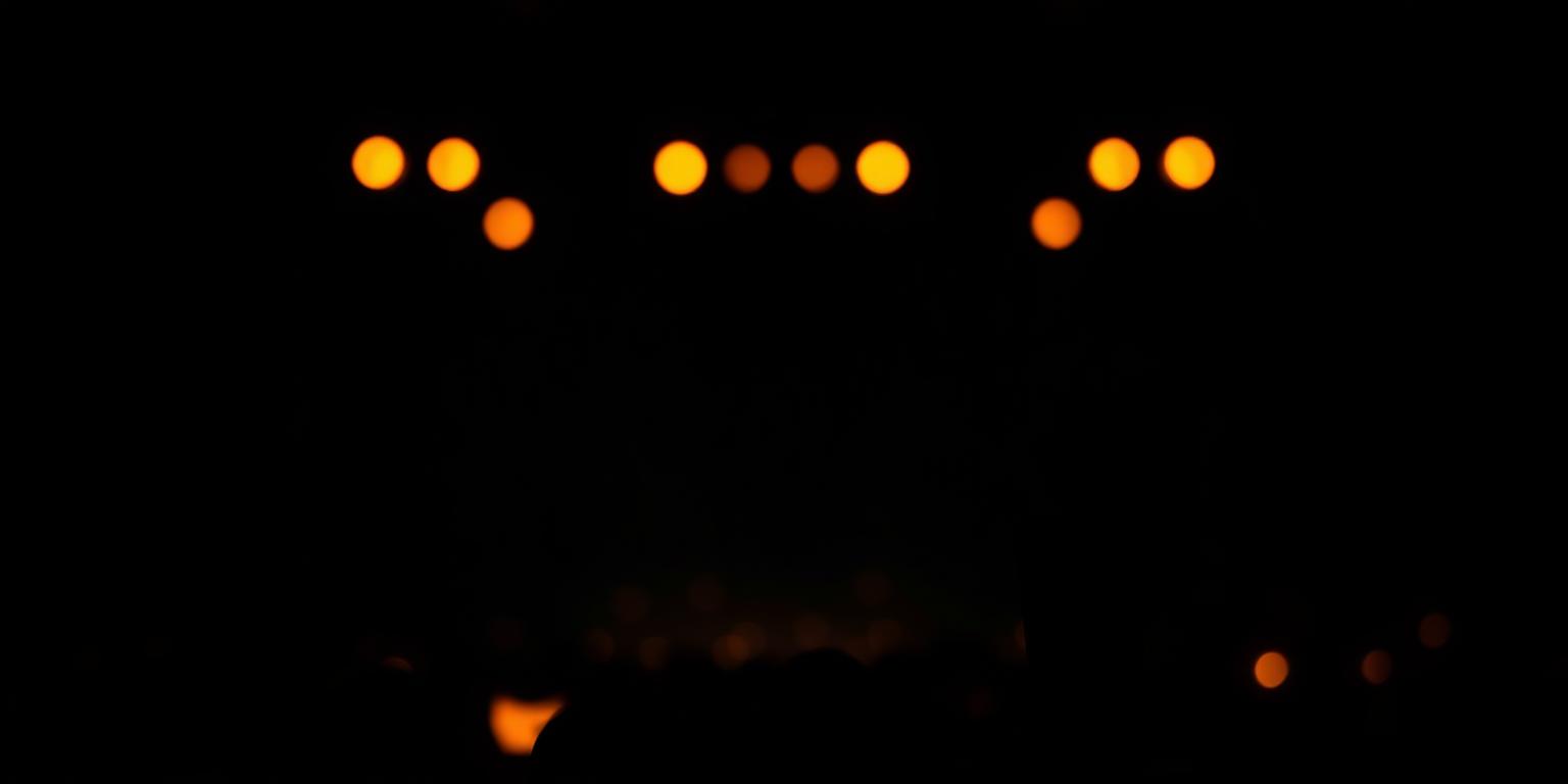 Stage lights glowing orange in the dark